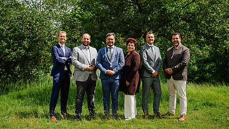 Groepsfoto van de collegeleden
